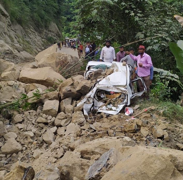 The car which was completely crushed by an avalanche of rocks at the unstable Chümoukedima stretch of NH 29 on September 19 morning. The occupants of the Tuensang-bound car managed to get out and get to safety. (Photo Courtesy: Dimapur Police)